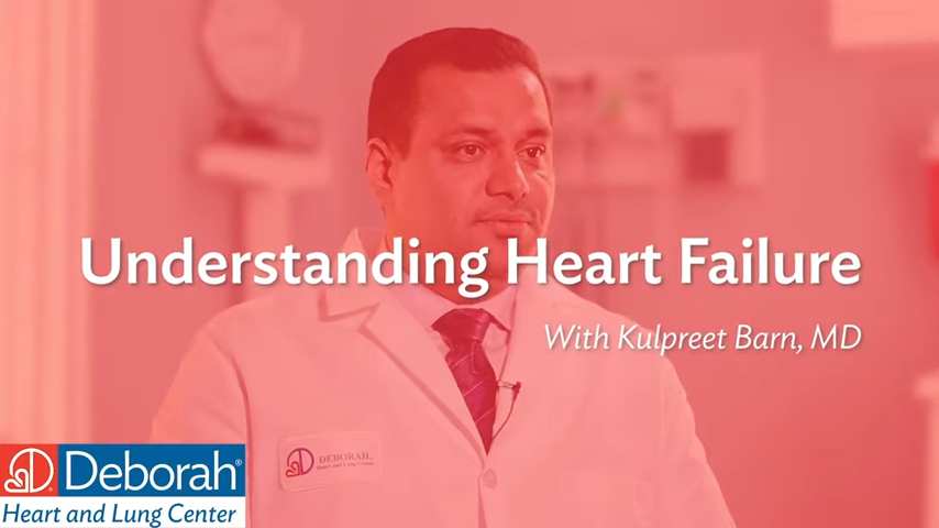red graphic that reads Understanding Heart Failure with Kulpreet Barn, MD. The graphic is transparent and overlays an image of the physician, a male with dark hear wearing a lab coat and dark neck tie