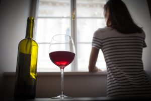 Woman with glass of wine