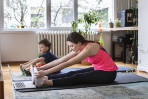 Mother and young son dong yoga together