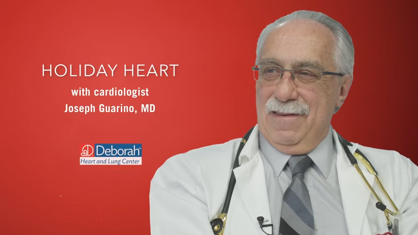 red graphic that reads Holiday Heart with Cardiologist Joseph Guarino, MD and also includes the Deborah Heart and Lung Center logo and a headshot of a white older male physician in a lab coat with a stethoscope around his neck