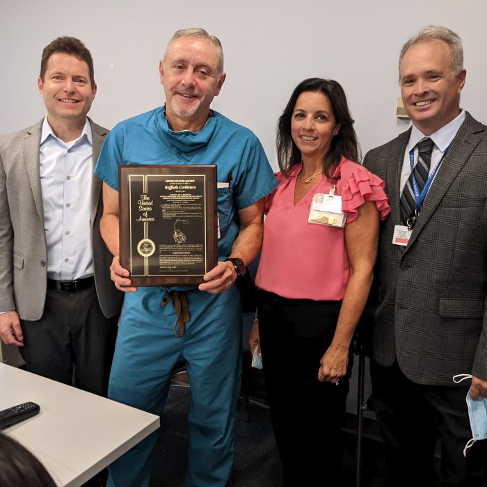 Dr. Corbisiero receives patent plaque
