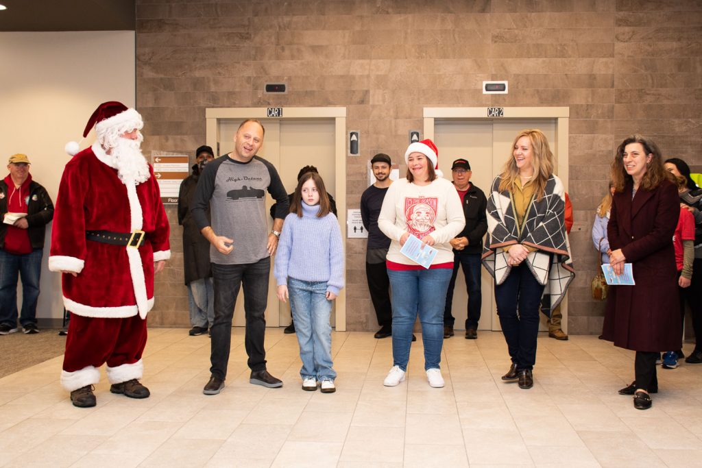 Thanks all around. From left, Santa, Chris Scafario, Founder High-Octane South Jersey with his daughter Annabella; Jenn Myers, Director, Pinelands Family Success Center; Rita Jenkins, Assistant Director of School Counseling/Health Services, Pemberton Township School District; Cara Garofalo, MD, Chair, Deborah Pediatric Cardiology.