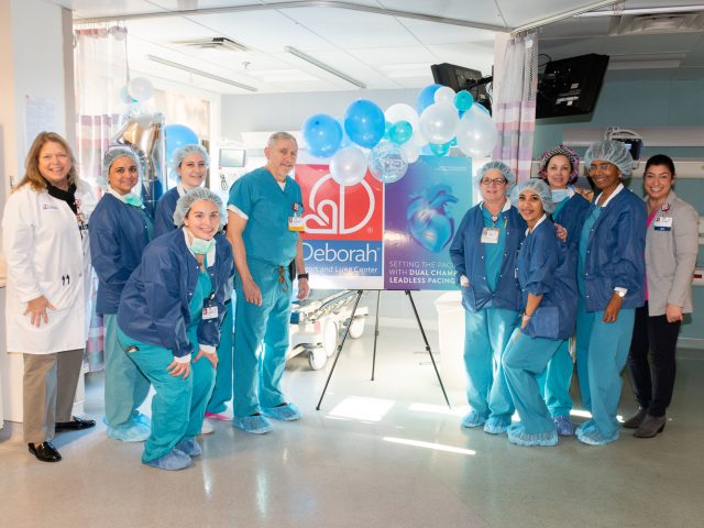 Shown is Dr. Raffaele Corbisiero (fifth from left) with the surgical team at Deborah Heart and Lung Center after a procedure to implant the Abbott AVEIR™ DR dual chamber leadless pacemaker.