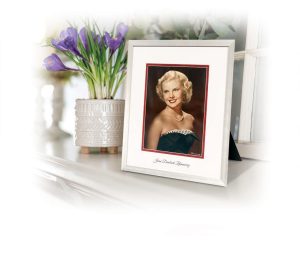 vignette that includes a photo of young blonde woman in picture frame