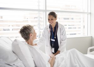 Female consultant smiling and talking with patient