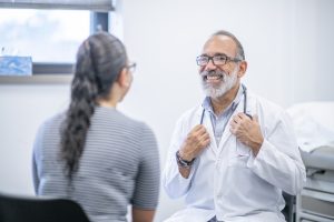 Male Doctor Meets With Female Patient