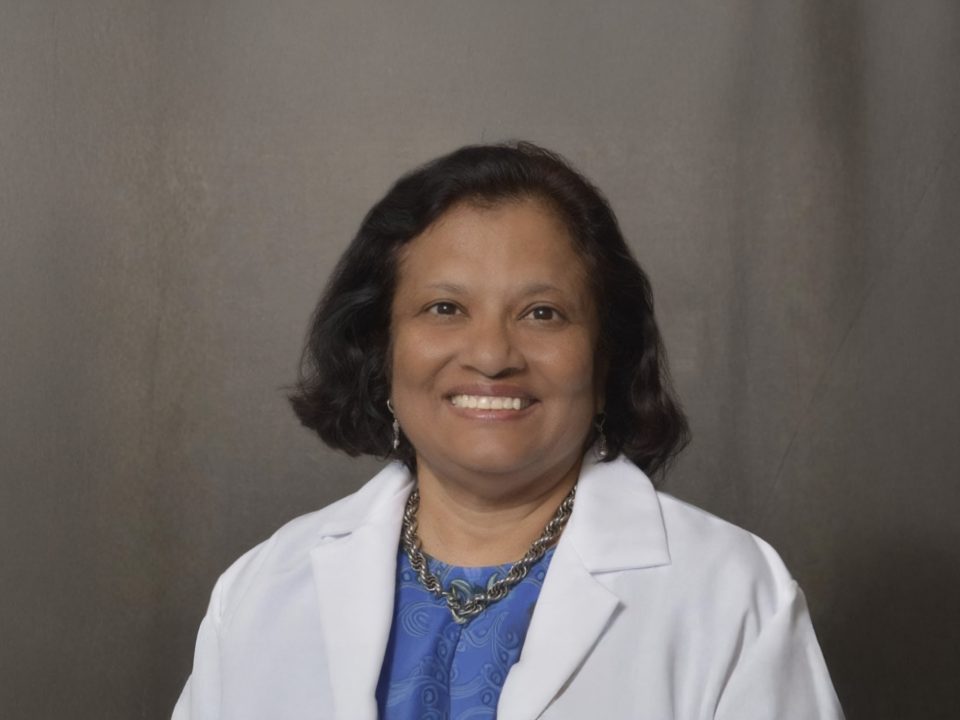 female physician in white lab coat