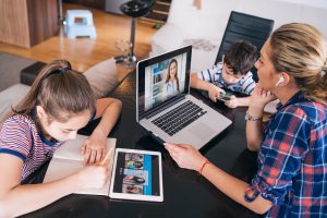 Mother talking with doctor on laptop