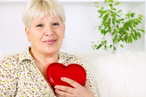 Woman with heart tin