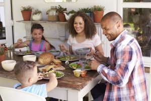 Family eating dinner at the table together