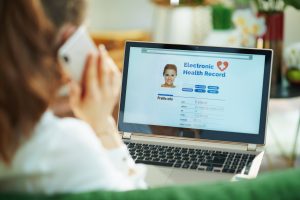 Woman examining her electronic health record on her laptop