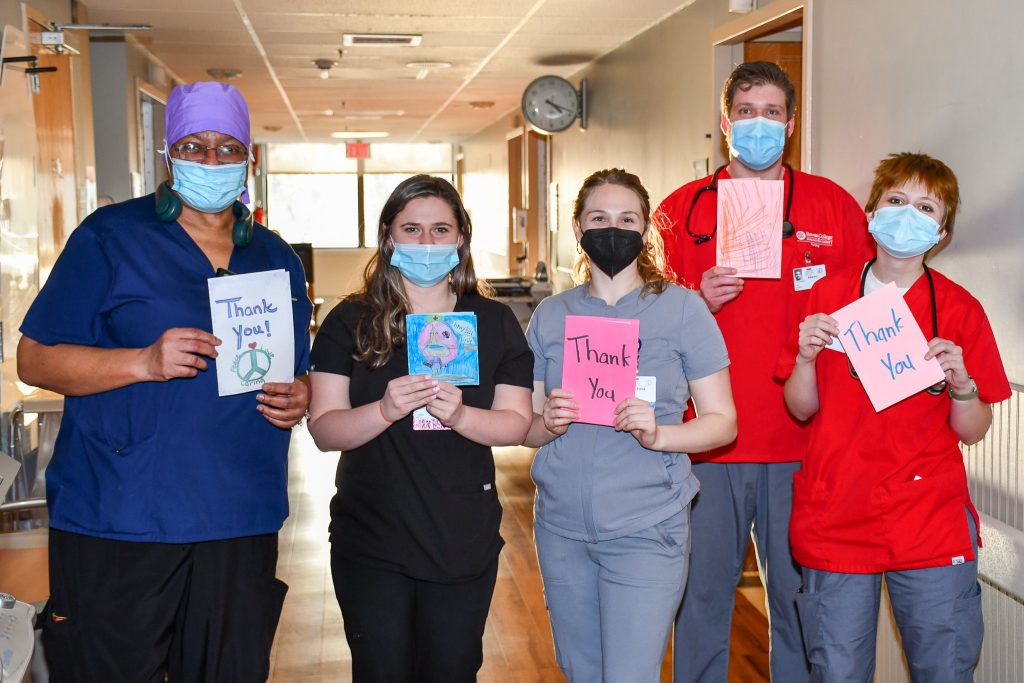 People Holding Thank You Cards