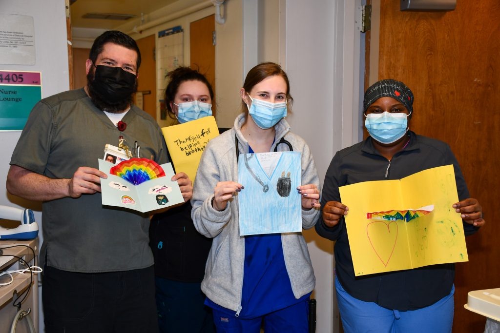 People Holding Thank You Cards