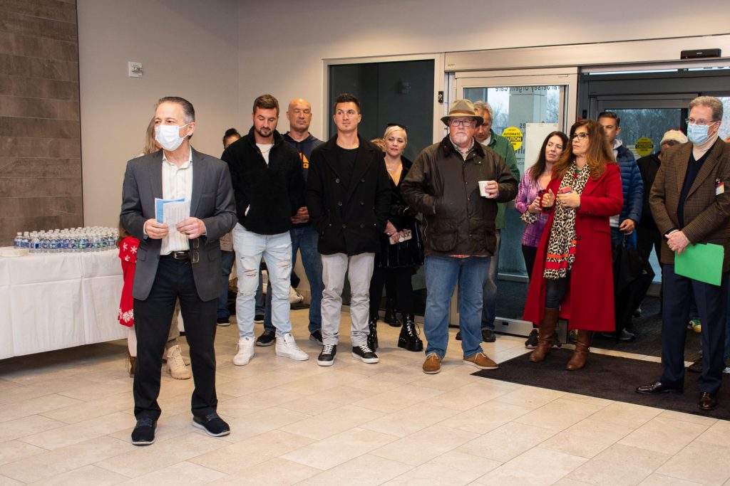 Deborah President and CEO Joseph Chirichella, and Executive Vice President and COO Joseph Manni, (far left and right) welcome the High-Octane South Jersey car club.