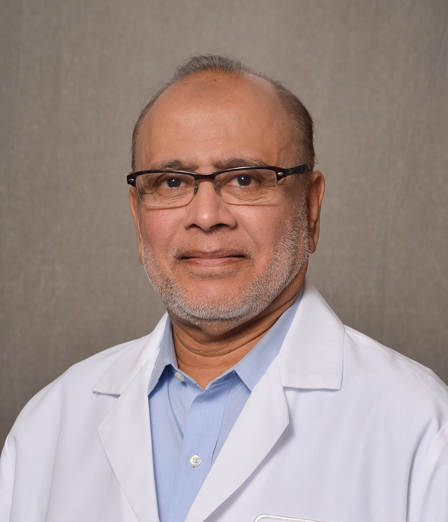 male physician wearing glasses and lab coat