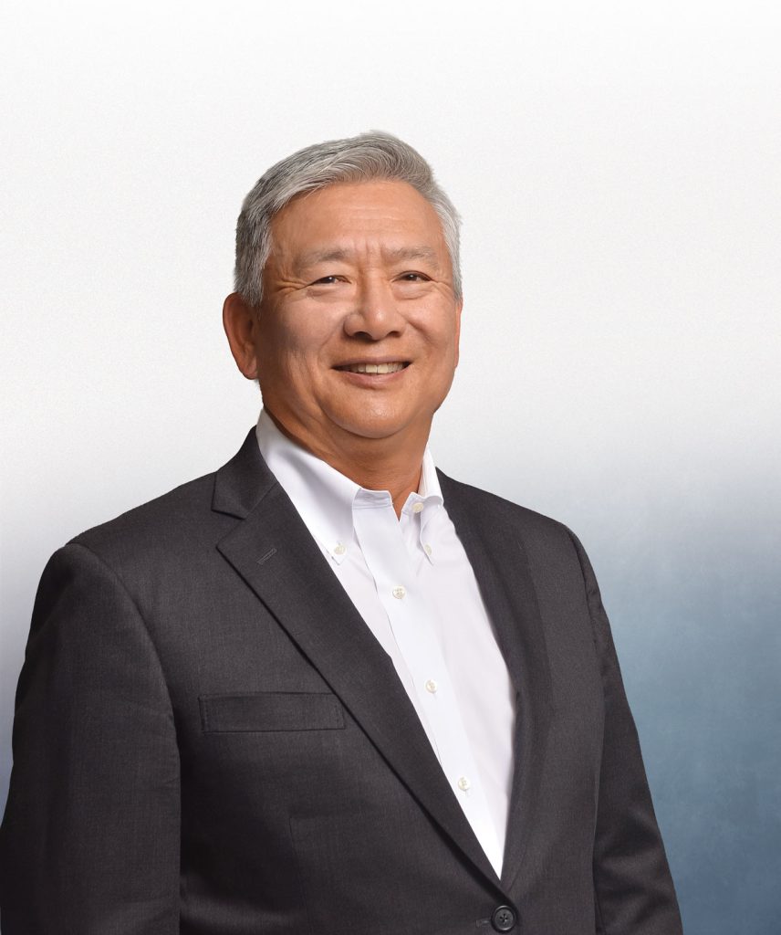 professional headshot of man in dark suit