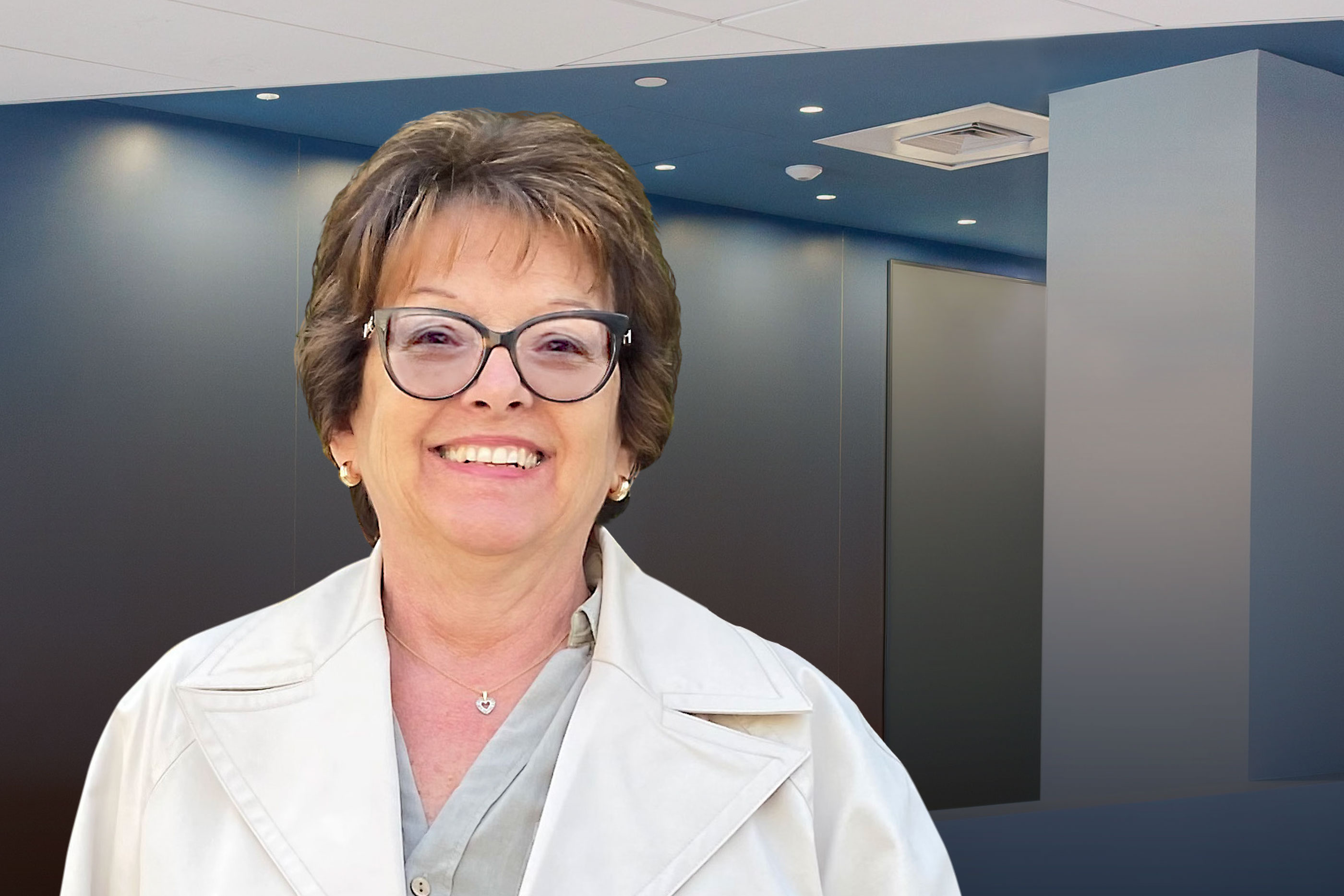 woman with short brown hair wearing glasses